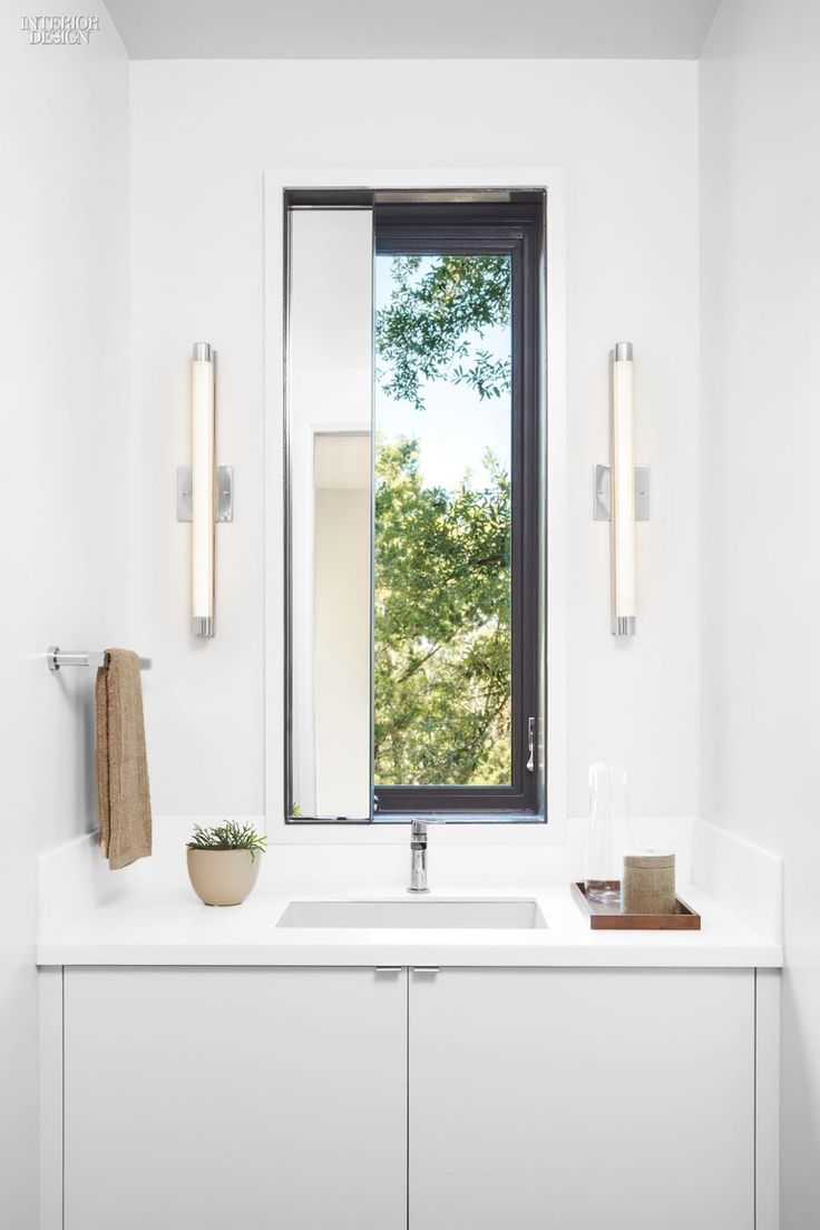 This bathroom features LED sconces....