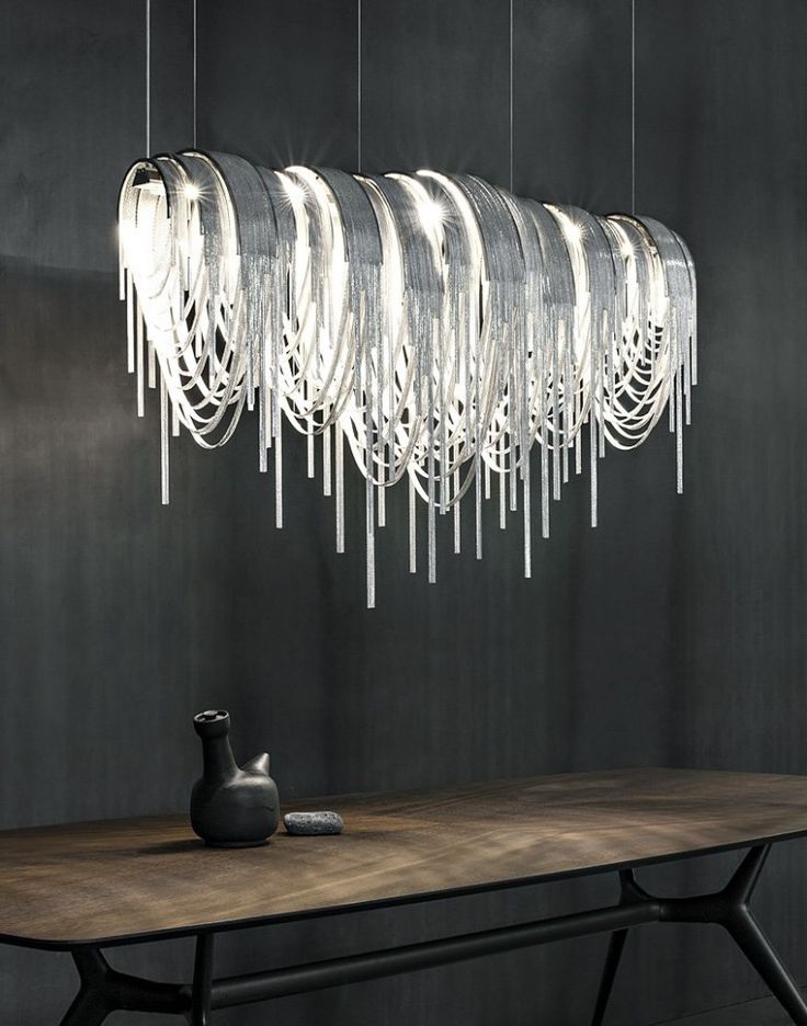 This dazzling chandelier has been made from thin nickel chains with LED lighting...
