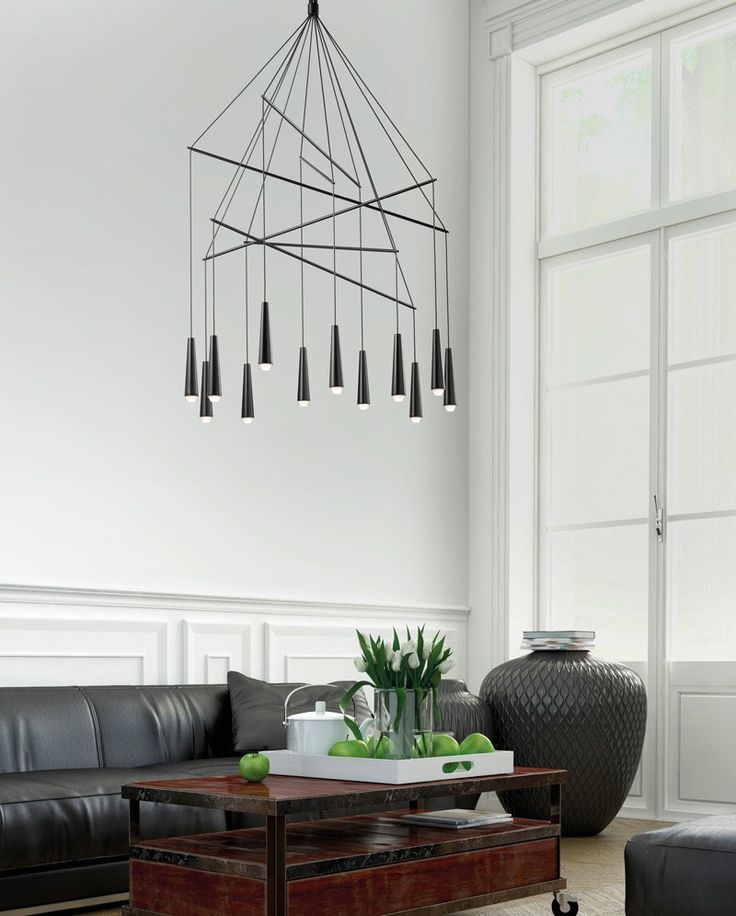 This minimalist chandelier is made from conical metallic elements that hide LED ...