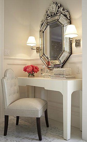 Love the vanity, chair, baroque mirror, sconces and the glasses....