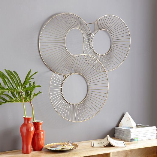 Reminiscent of a roller coaster, the Spiral Spray Wall Art features three interl...