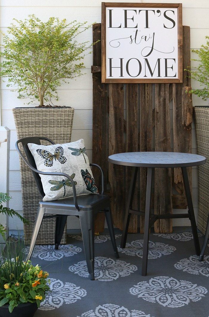 Metal farmhouse chairs, indoor/outdoor rug look great with the shiplap wall and ...