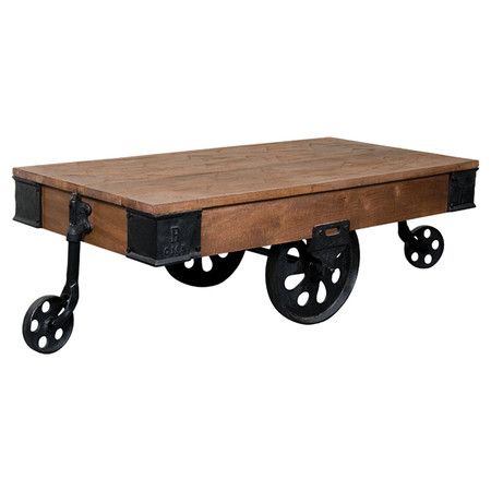 Rail cart-inspired coffee table made from mango wood and black iron. Product: Co...