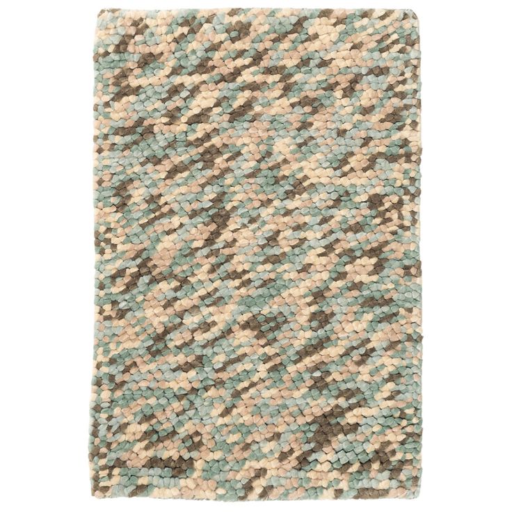 Recreate that relaxing, feet-in-the-sand feeling with this woven wool area rug...