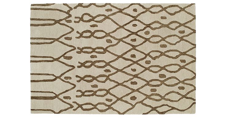 Subtle Moroccan influence is evident on this hand-tufted wool rug. An understate...