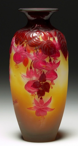 A vintage art glass vase by Galle in shades of amber, fuchsia, pink and yellow.