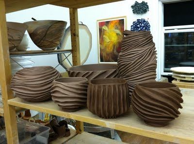 coils on outside of pots to create interesting surface design....