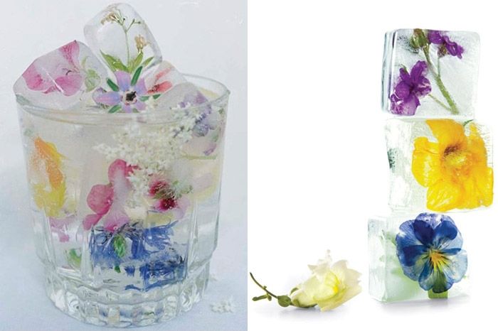 Fill an ice tray a quarter of the way with water, add flowers facing down, and f...