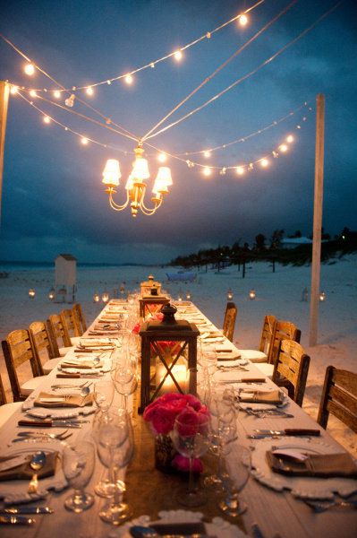 nighttime beach wedding reception lighting