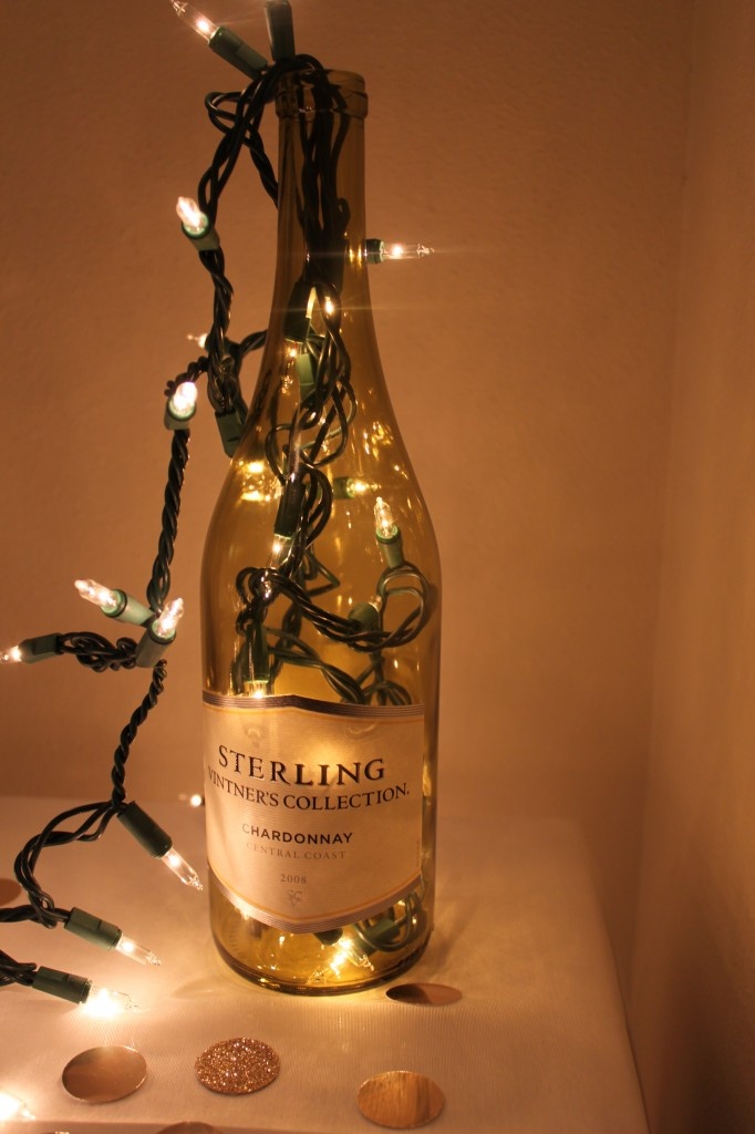 Lights in a wine bottle  (cool idea for barn wedding and use the cork name tags!...