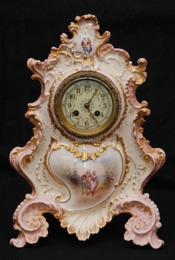 19th century French porcelain mantle clock. The Limoges porcelain case with orna...