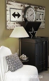 an old plank door serves to make two old traffic signs and a broken clock into w...