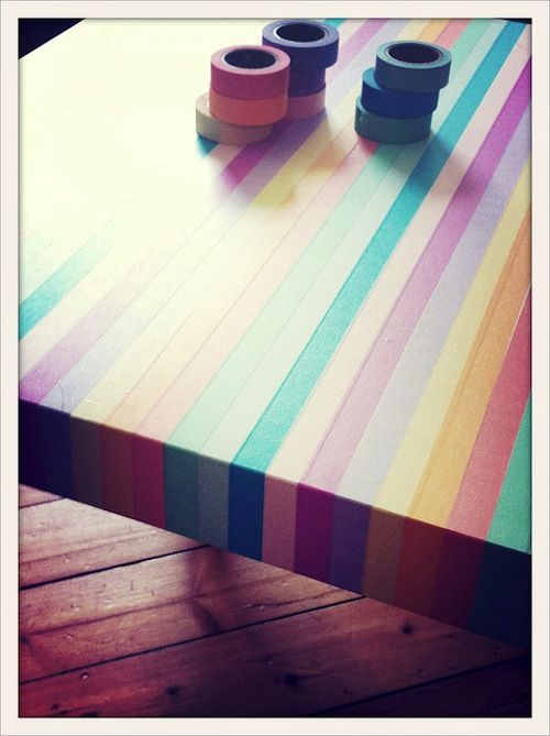 Washi tape rainbow table. This would be cool as a bench top in the kids crafting...