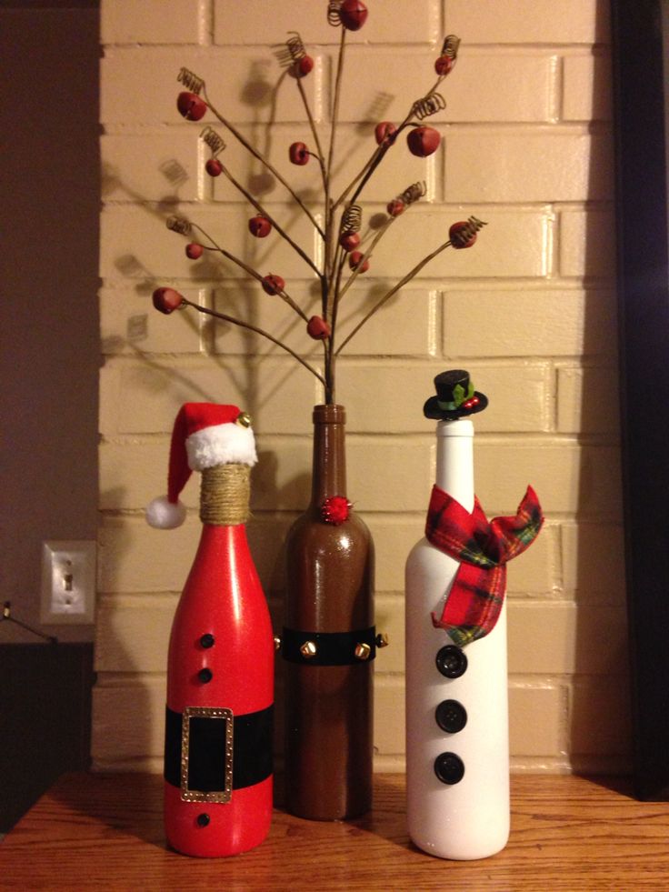 Santa, Reindeer, Snowman trio for the Holidays made from wine bottles.