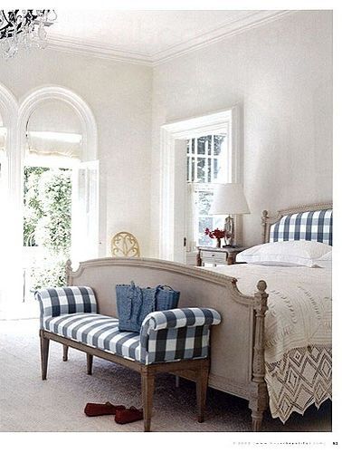 A bedroom in blue and white checks done by Kathryn Ireland of California.