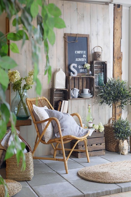 Recycled crates and a wicker chair give this patio a french country look - #DIY ...