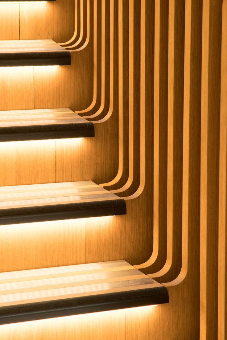 Each of the stair treads in this sculptural staircase have hidden lighting benea...