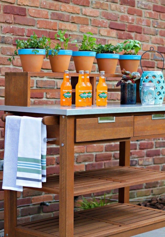 perfect addition to an outdoor dining space  - an outdoor bar cart/plant cart