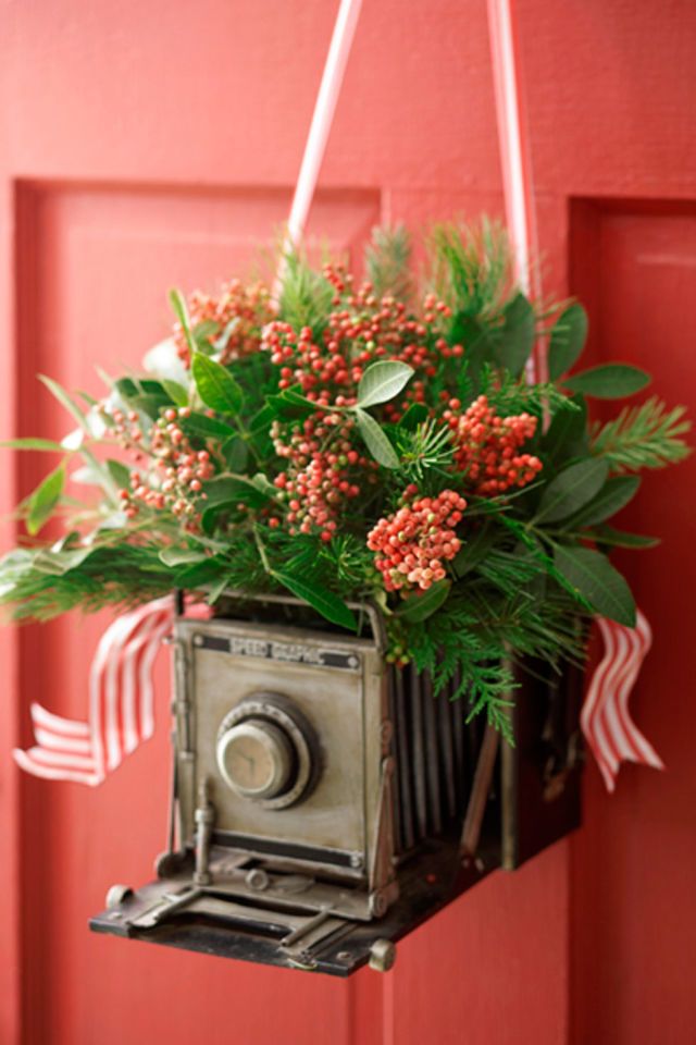 Want to show off your love of antiques? Hang a vintage camera from your front do...