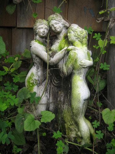 Three green garden goddesses