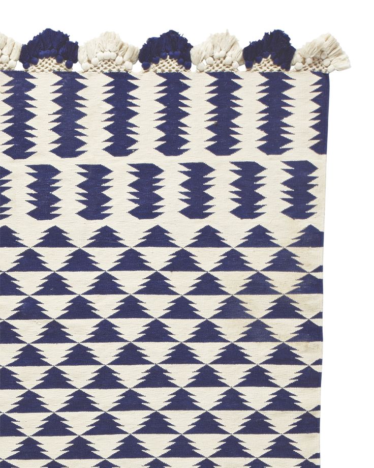 geometric design and eyelash fringe flat weave dhurrie rug