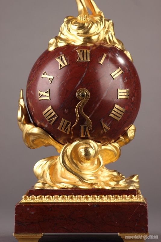 A red marble and ormolu 1900 small clock with nymph signed DORVAL