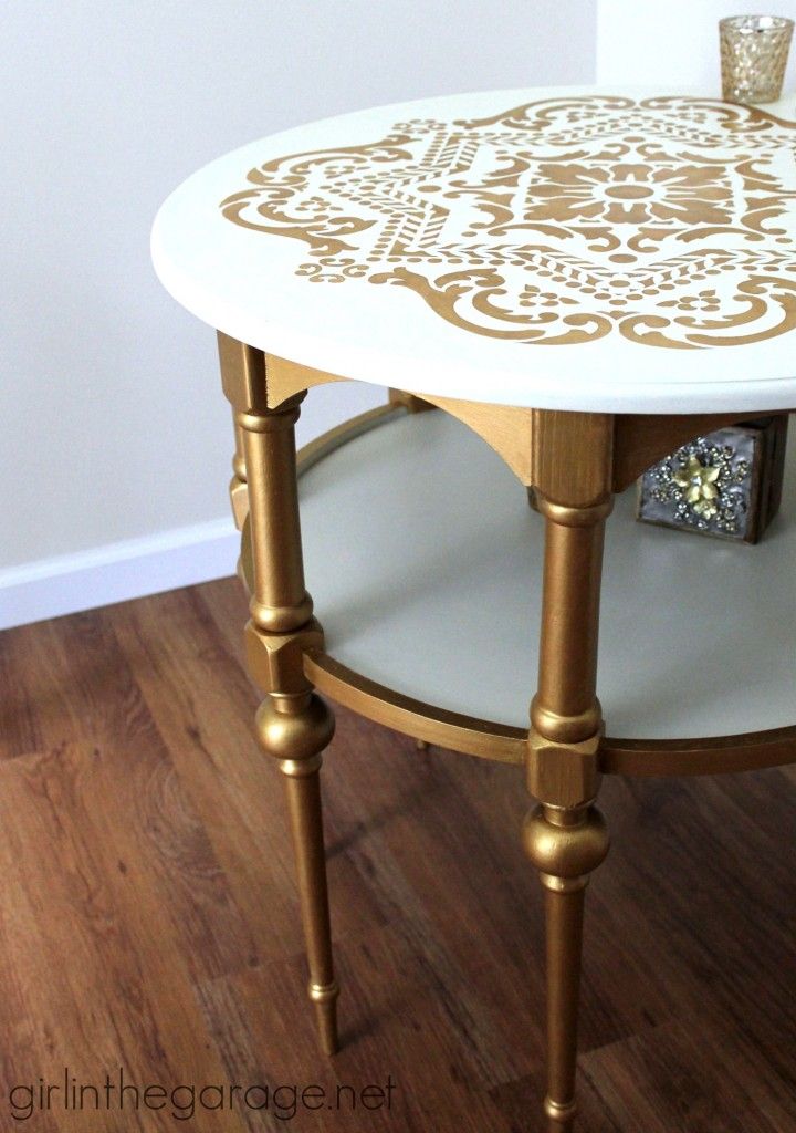 A stunning stenciled table makeover in metallic gold and white
