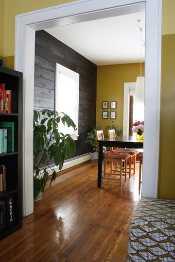 Love this wall design  - Shiplap wall that creates texture and the mustard yello...