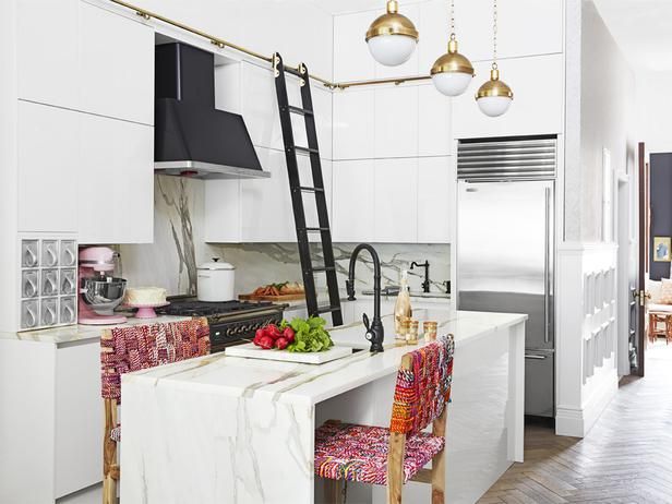 Stunning white kitchen with brass pendants and black faucets, PLUS a rolling lad...