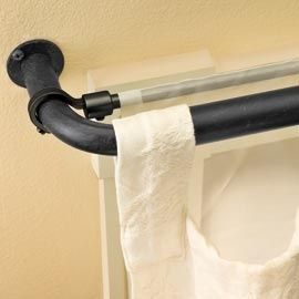 Use a bungee cord to instantly hang a second sheer curtain panel behind existing...