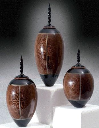 By woodturner Kim Blatt | Three of a kind - Ebony and Holly lidded vessels #wood
