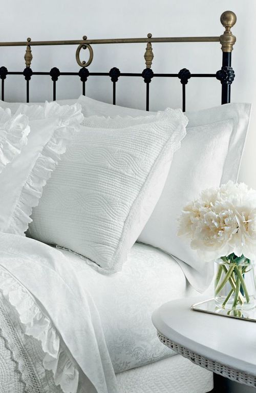 White Linens, Brass & Black Bed