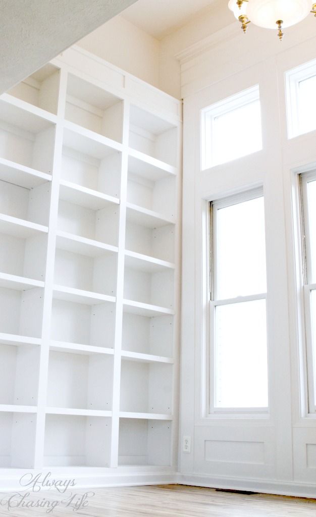 Super tall, built-in bookshelves and window wall trim.