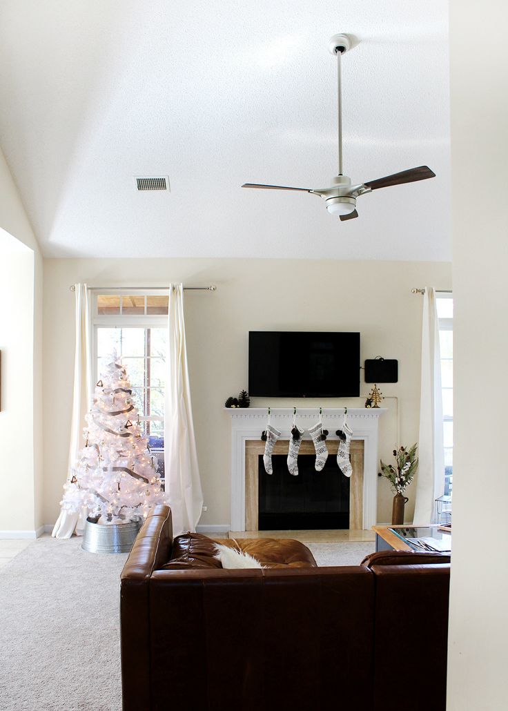 love the simple white decor and tree! A Modern Holiday Home Tour | Christmas dec...