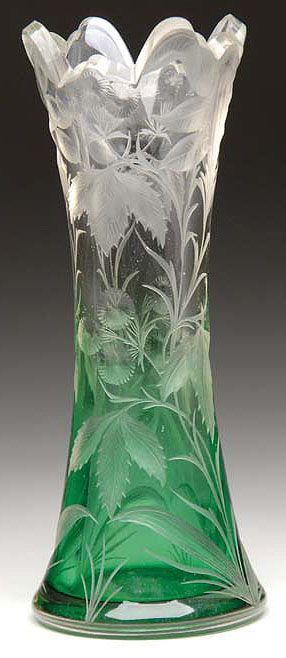 A Moser engraved vase, green glass shading to clear with an allover engraved flo...
