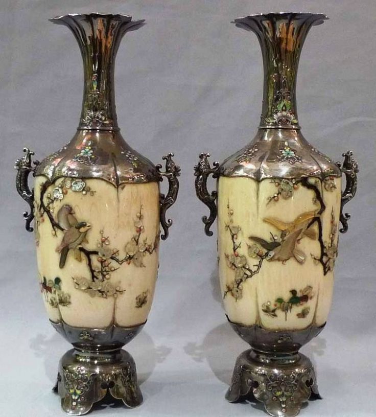 silver and ivory vases