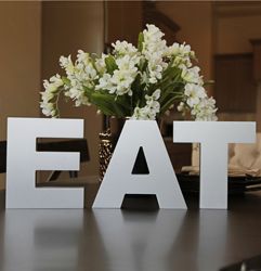 Standing wood letters sit proudly on any flat surface.