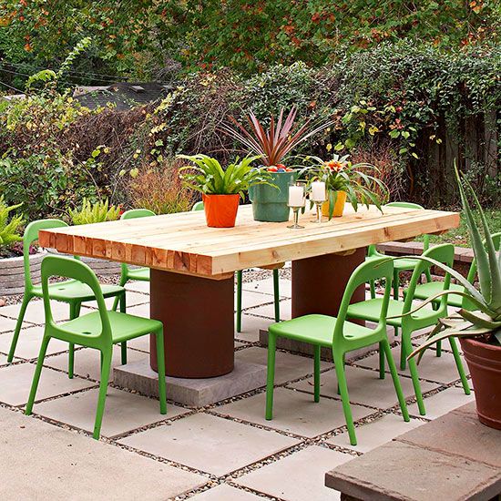 Though it looks like a pricey designer piece, this cedar patio table was actuall...