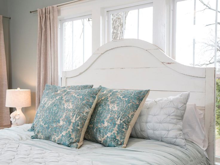 Love this pale blue & white bedroom with it's beautiful custom-made wooden h...