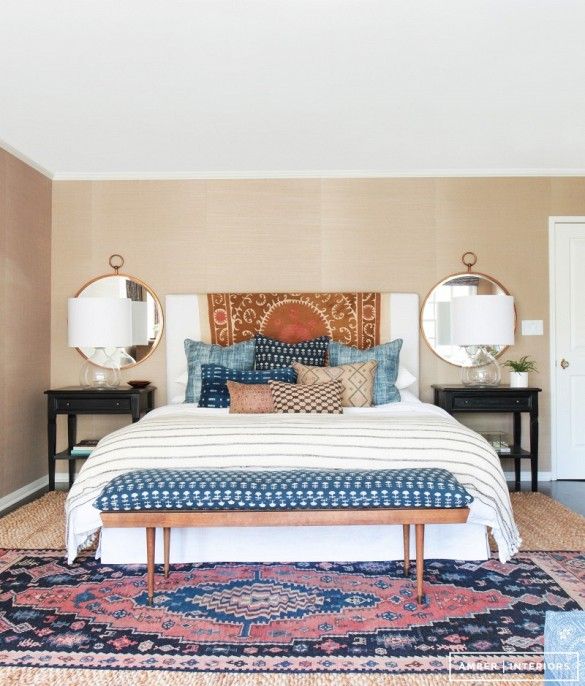Symmetrical master bedroom with mirrors behind nightstands - california eclectic...