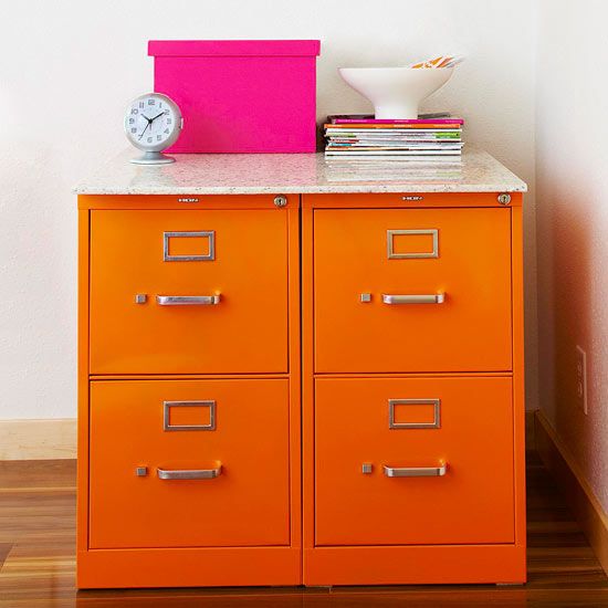Use spray paint to tansform old file cabinets. Marble slab dresses it up.