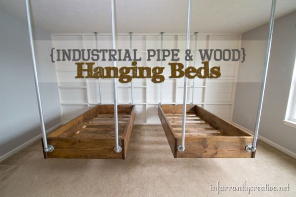 Industrial hanging beds made from wood and threaded pipes.