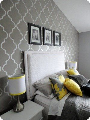 Love the simple lamp, the grey bedding and the colorful pillows