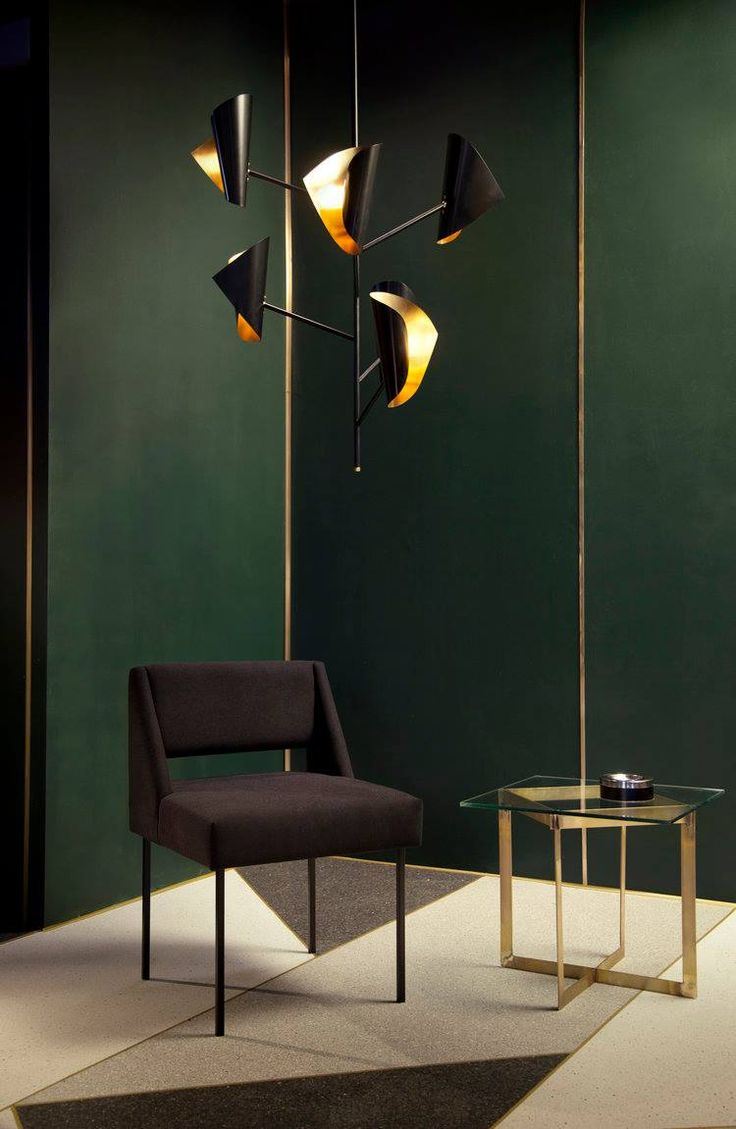 Crafted from solid brass, the shades on Atelier de Troupe’s Cigale pendant als...
