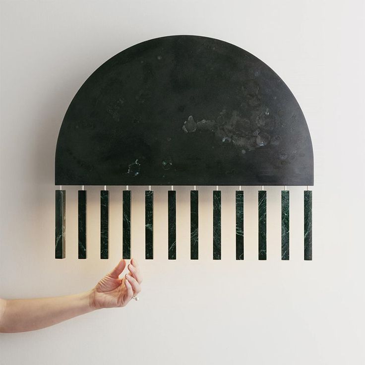 PELLE + Erie Basin collaborated on the Dark Moon Sconce made of exotic Serpentin...