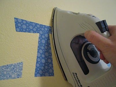 Whaaat? Didn't know you could iron fabric onto the wall? Just as easy as vin...