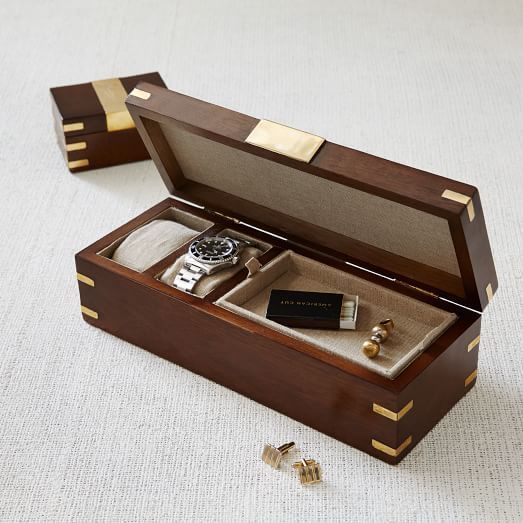Made of sheesham wood and accented with real brass, this watch box is a stylish ...