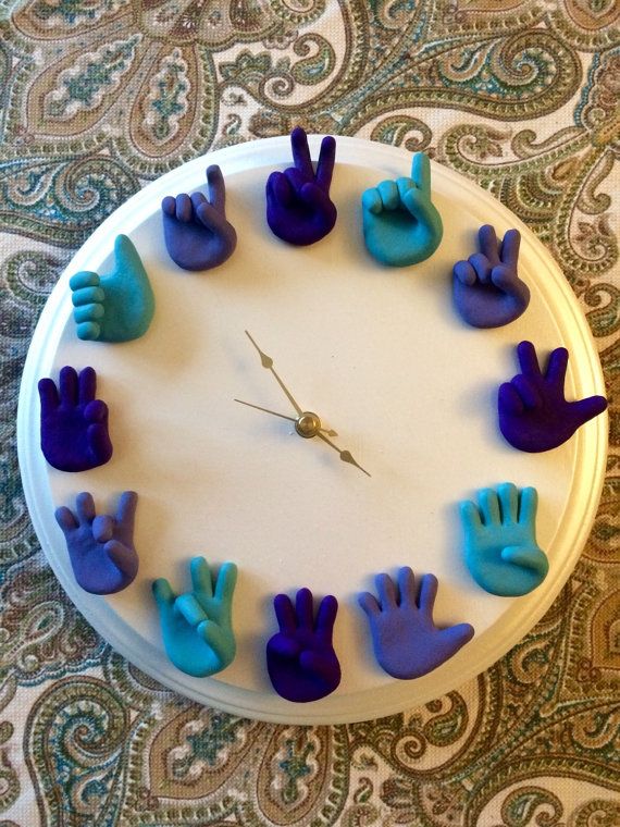 Hand Sculpted American Sign Language Clock is a unique piece of wall art that lo...
