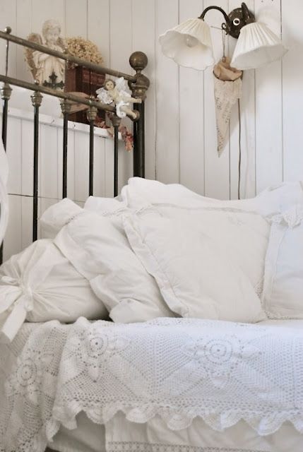 Shabby Chic, check out the bed frame & I love the textures of the bedding.