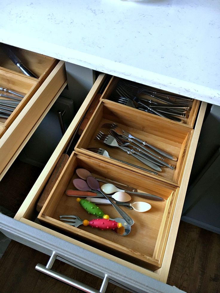 Organize with bamboo trays for utensils